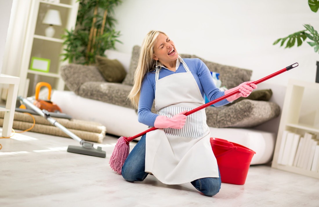 happy young woman enjoying while sprucing up her house