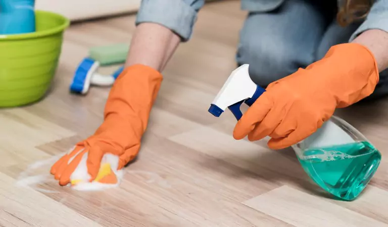 cropped picture of a person cleaning a floor
