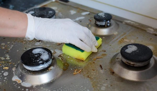 A person cleaning gas magnets