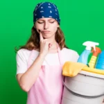 Caucasian pretty blonde woman housekeeper and clean products concept